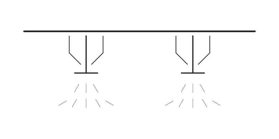 A simple black and white line drawing shows two ceiling-mounted fire sprinklers releasing water downward, depicted by angled lines spreading from each fire sprinkler head.