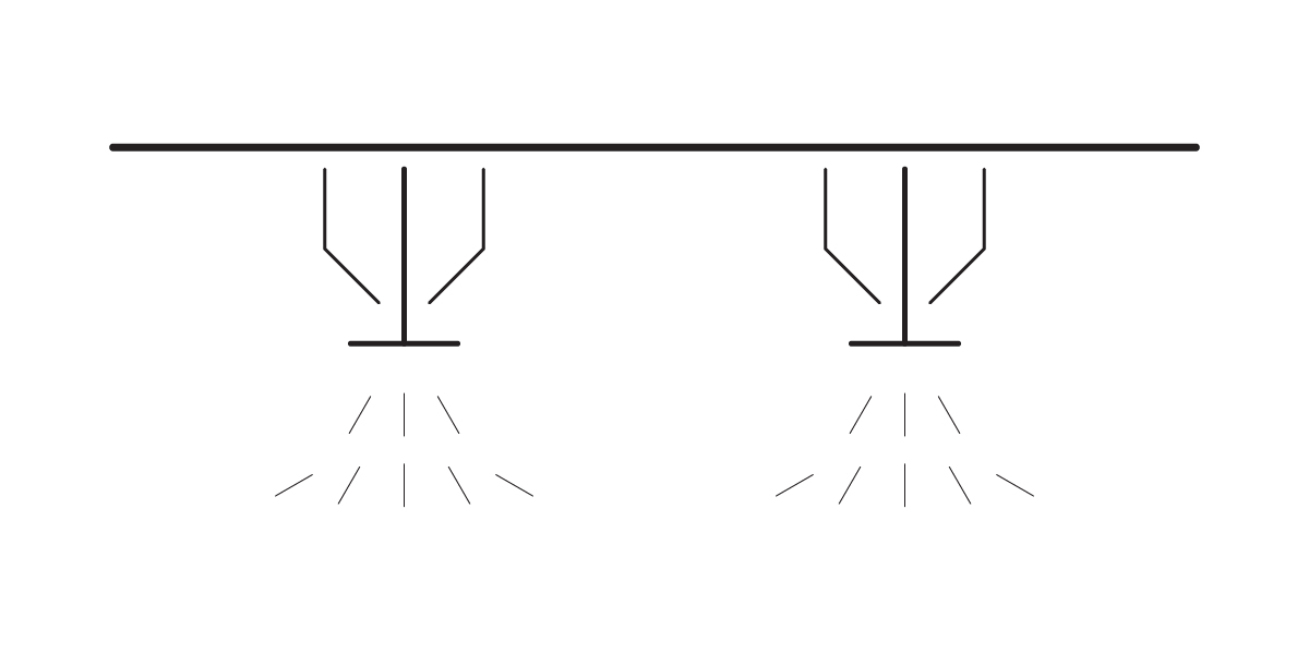A simple black and white line drawing shows two ceiling-mounted fire sprinklers releasing water downward, depicted by angled lines spreading from each fire sprinkler head.