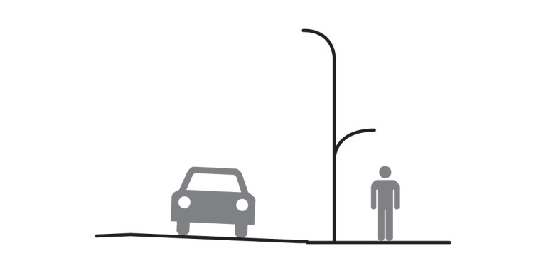 A simple illustration showing a car on a road next to a sidewalk, featuring thoughtful site design with a streetlight and a person standing on the sidewalk.