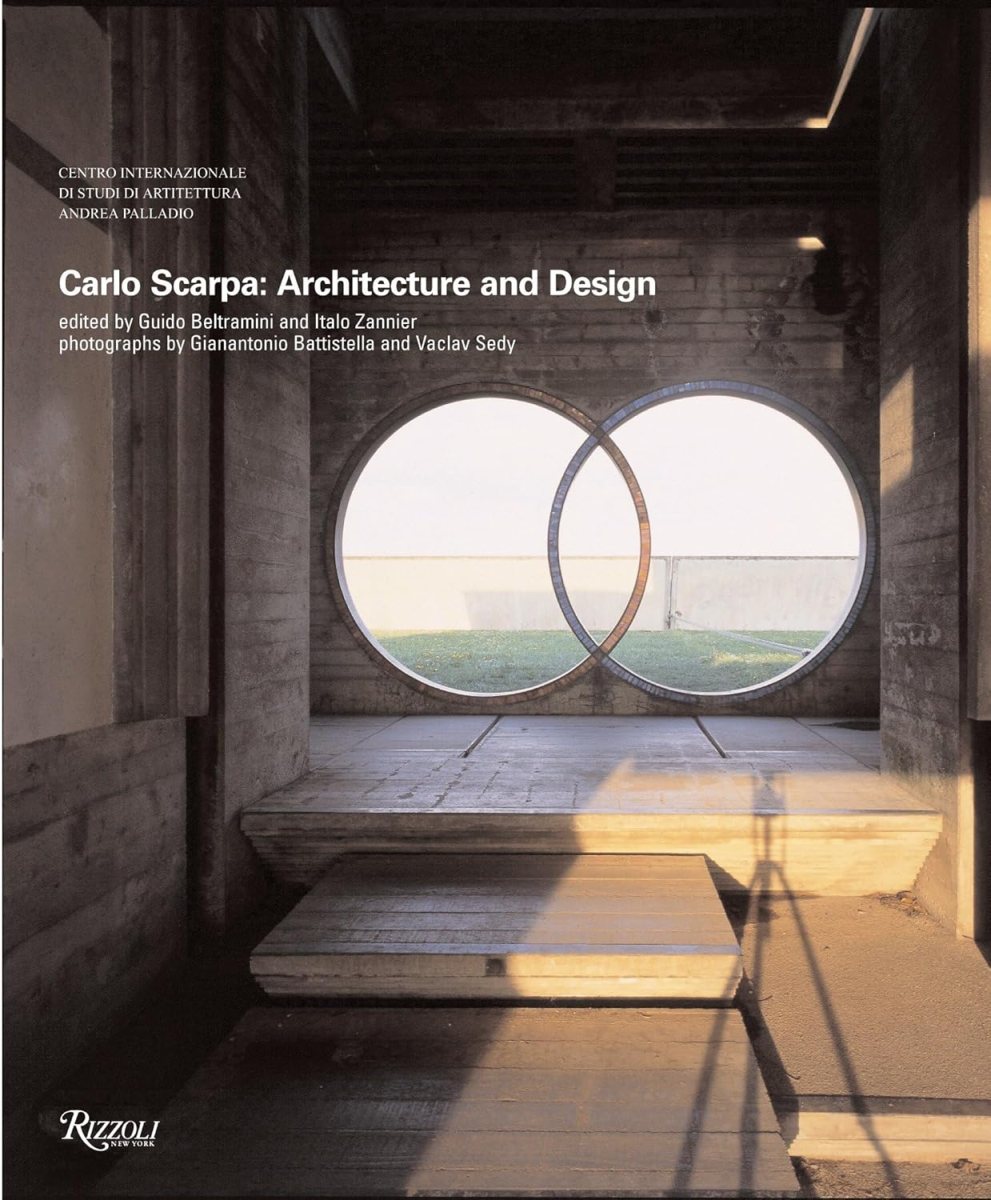 Cover of the book Carlo Scarpa: Architecture and Design—an ideal pick for any architect or student—features two intersecting circular windows set in a concrete wall, casting dramatic shadows and light inside a minimalist space.