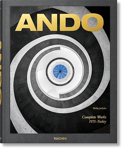 Book cover for ANDO: Complete Works 1975–Today by Philip Jodidio, featuring a top-down view of a spiral staircase with a blue center. Perfect for architect gifts or student gifts, the title appears in large gold letters at the top.