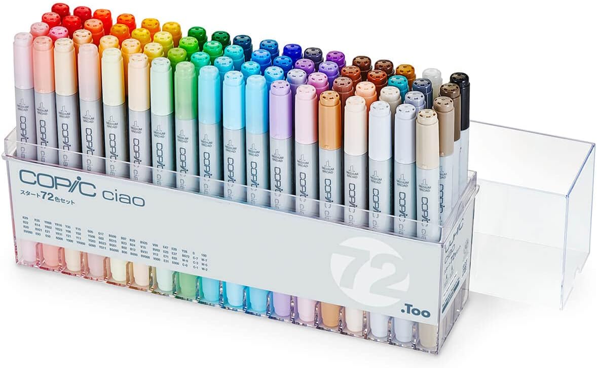 A clear plastic case of 72 Copic Ciao dual-tip markers is shown, arranged by color in rows—an ideal pick for student gifts or those browsing the holiday gift guide. The case features a pull-out storage drawer on the right side.
